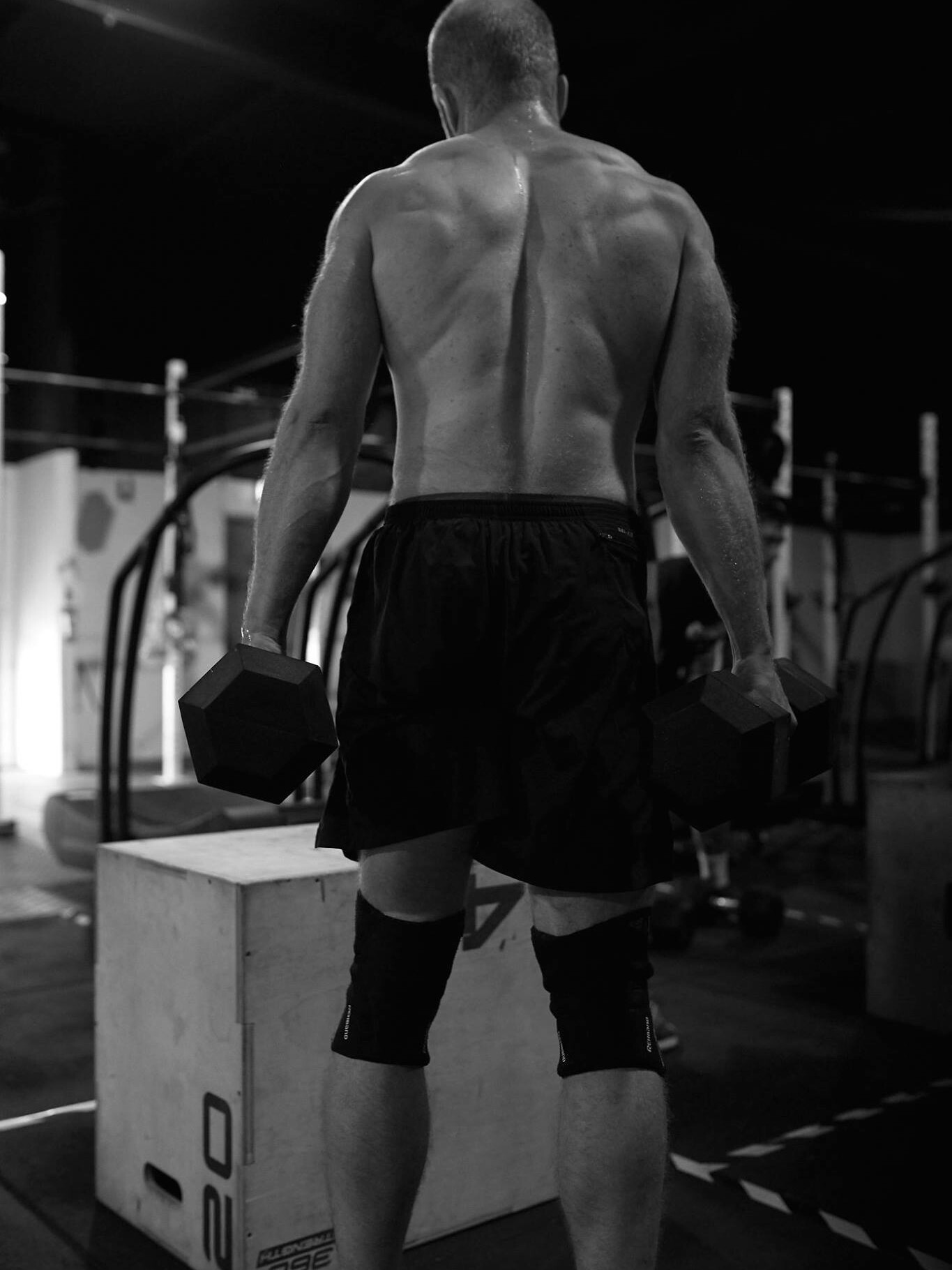 A men doing excersise inside CrossFit Noble Gym